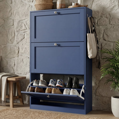 Blue shaker shoe cabinet positioned in hallway with lower open rack for frequently worn footwear