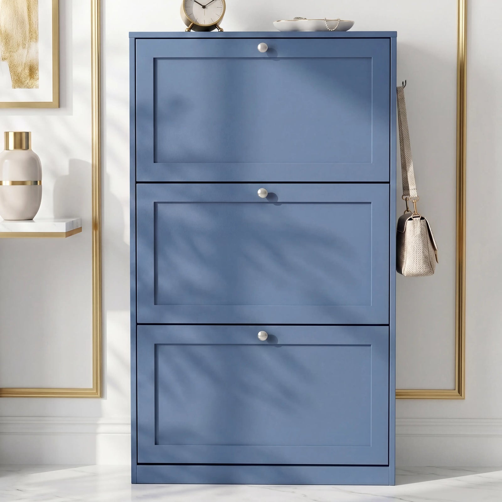[Blue] Shaker Shoe Cabinet closed three-door flip-front unit against white panelled wall with woven basket and linen tote bag alongside