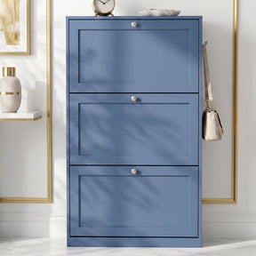 [Blue] Shaker Shoe Cabinet closed three-door flip-front unit against white panelled wall with woven basket and linen tote bag alongside