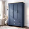 [Blue] Shaker triple wardrobe in navy blue with oak top, three panelled doors and two base drawers, angled view.