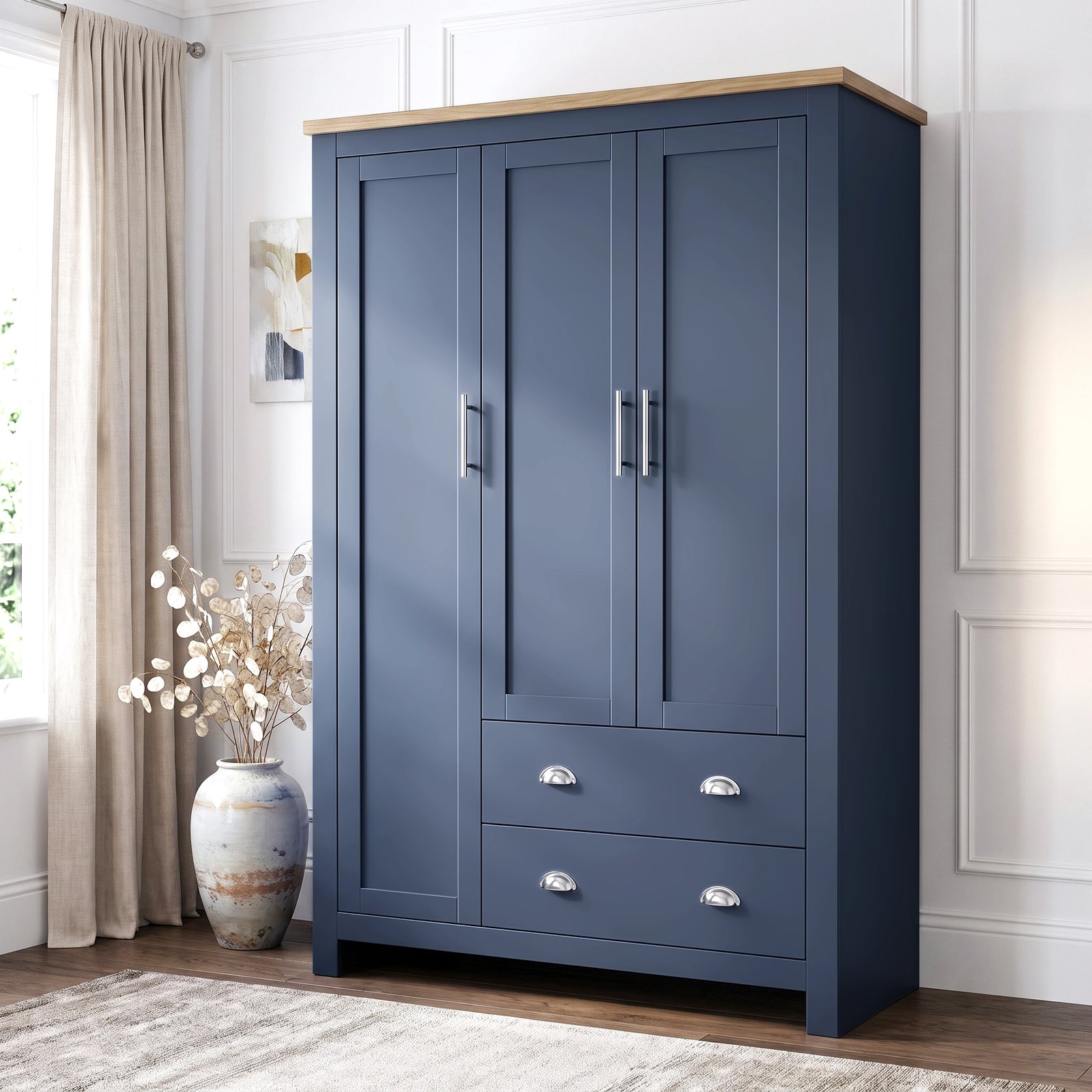 [Blue] Shaker triple wardrobe in navy blue with oak top, three panelled doors and two base drawers, angled view.