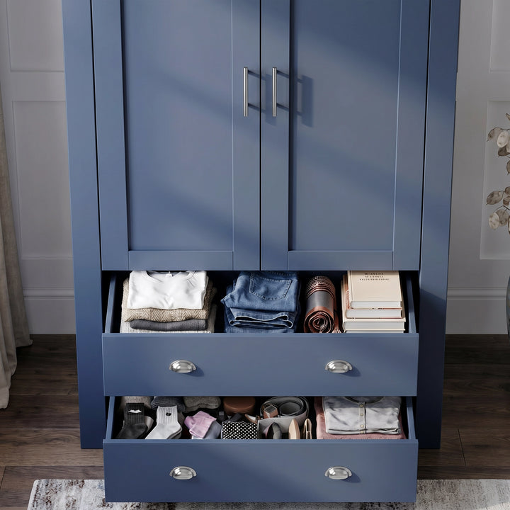 [Blue] Wardrobe lower drawers open with folded clothes, shoes, belts, boxes, closed upper doors, and panelled wall