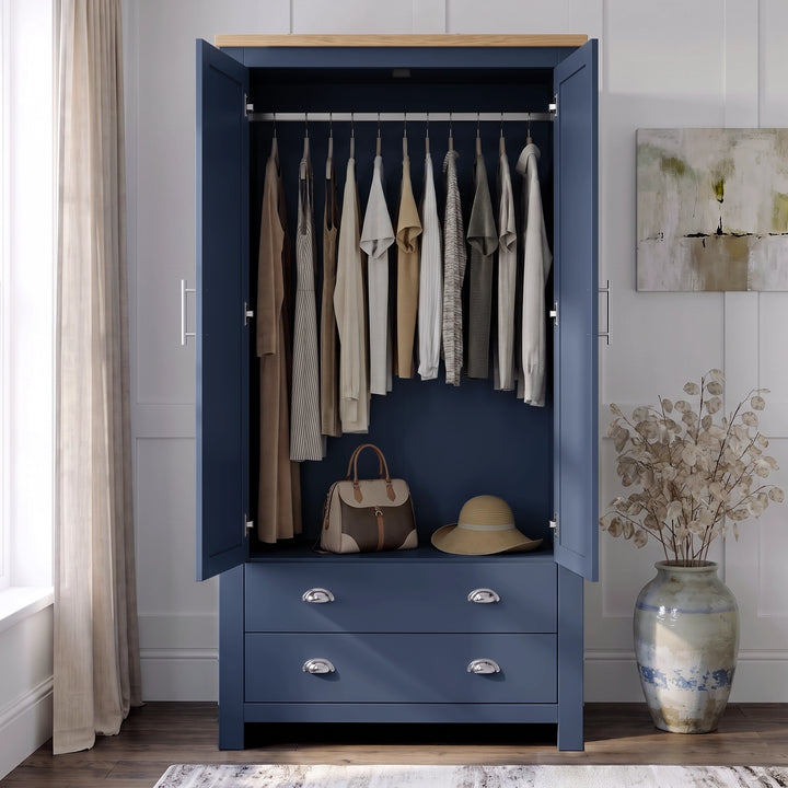 [Blue] Wardrobe interior view with both doors open, hanging clothes, top shelf, lower drawers, handbag, and hat