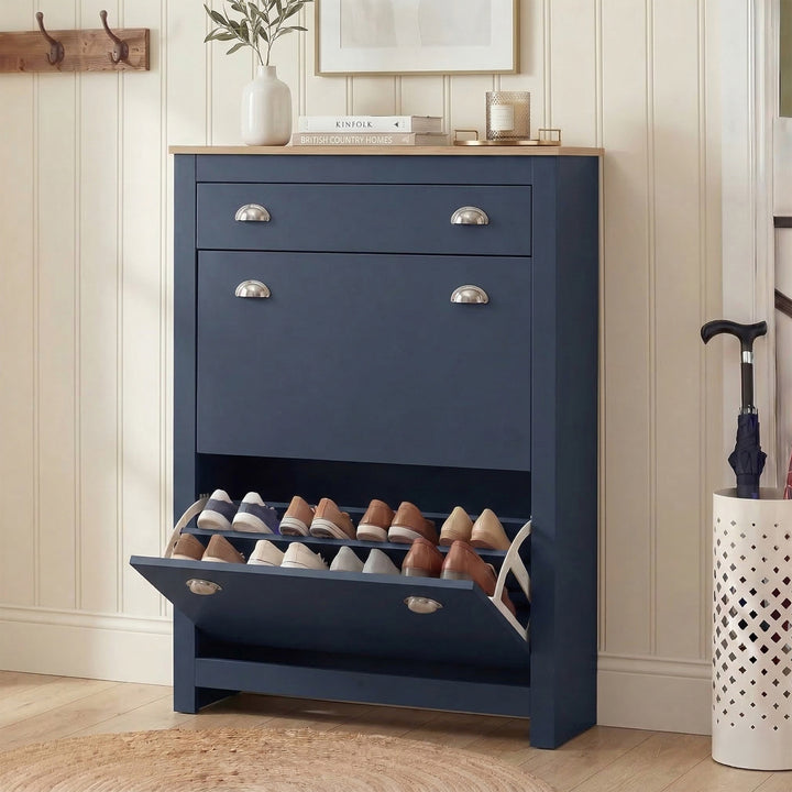 [Blue] Shoe Cabinet With Drawer in a hallway, lower flip-down door open revealing two tiers of shoes, oak top with books 