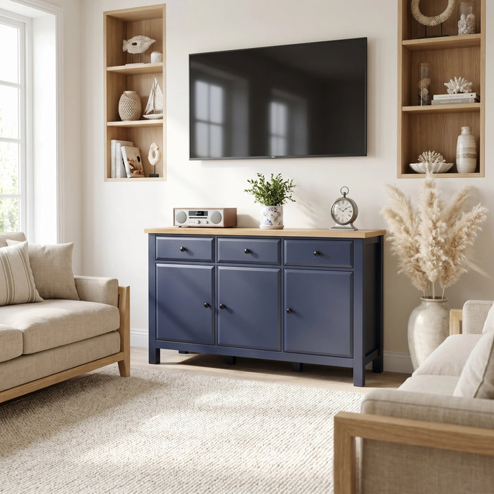 [Blue] Blue 3 Door Sideboard with 3 Drawers, 135cm Oak Veneer Top used as a console below a wall TV.
