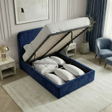 Single blue velvet ottoman bed lifted to reveal under-bed storage space beneath the slatted mattress base