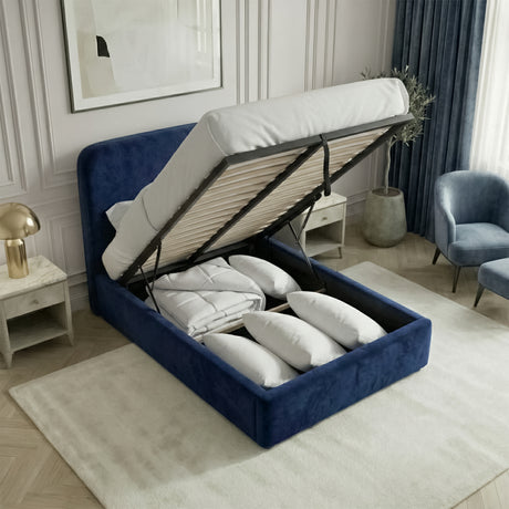 Single blue velvet ottoman bed lifted to reveal under-bed storage space beneath the slatted mattress base