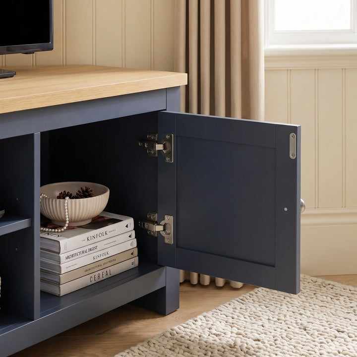 [Blue] Tavero corner TV unit open compartment showing soft close hinges and interior storage