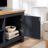[Blue] Tavero corner TV unit open compartment showing soft close hinges and interior storage