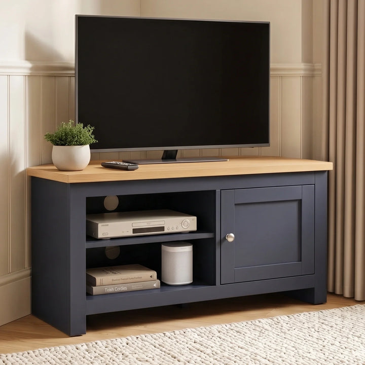 [Blue] TV stand with a light wood top, shown in a styled living room setting with a flat-screen TV, a small potted plant, and decorative items on the shelves.