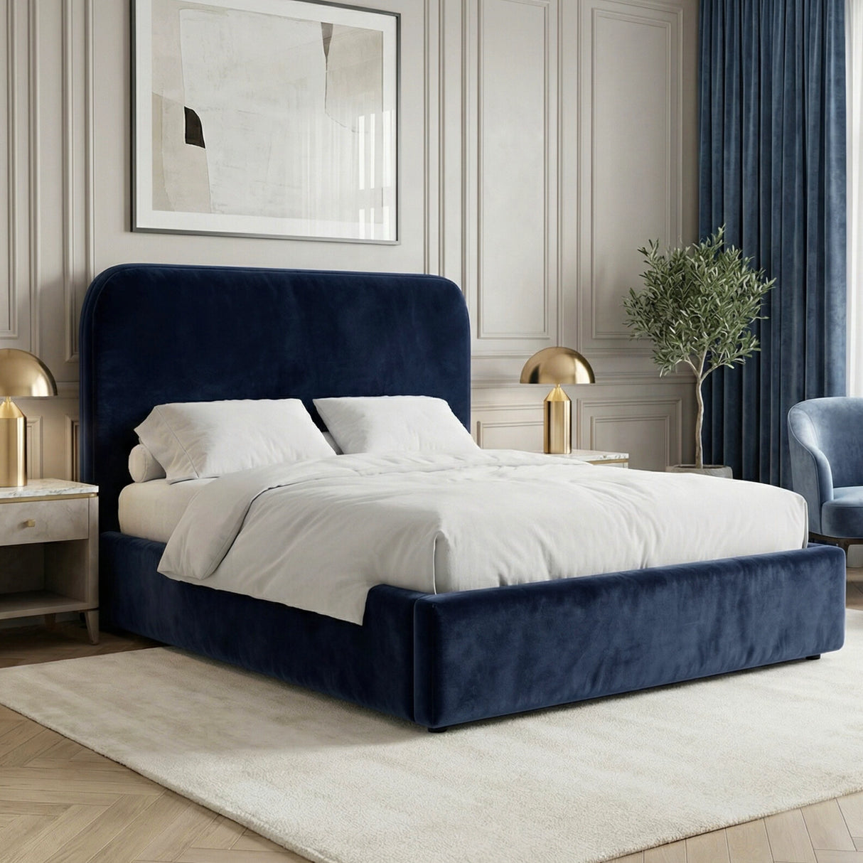 Blue velvet king ottoman storage bed placed in a bright interior with a padded headboard and upholstered frame