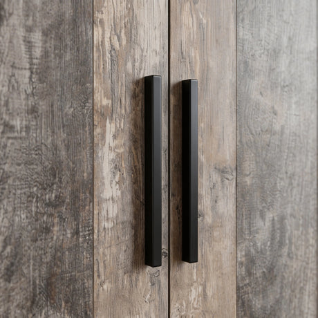 [Ash Grey] Black handle close-up on Blythe wardrobe showing grey plank door grain behind