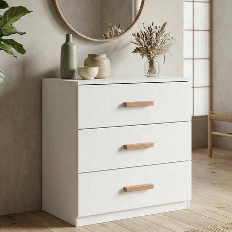 [White] Blythe chest of drawers in white with wooden handles next to arched mirror and pampas arrangement