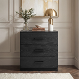 [Black] Blythe bedroom furniture set 3 drawer chest shown head on against a cream panelled wall