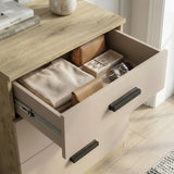 [Oak Cashmere] Close view of the Blythe bedroom furniture set chest top drawer showing oak edge and black handle