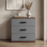 [Walnut] Blythe bedroom furniture set 3 drawer chest closed beside artwork with books and vase on top