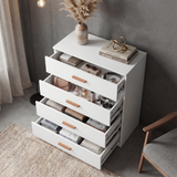 [White] Blythe bedroom furniture set chest showing four open drawers stacked with folded clothing inside