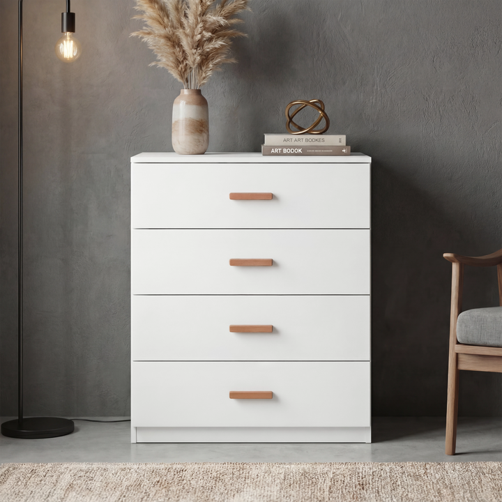 [White] Blythe bedroom furniture set 4 drawer chest in room with pampas grass vase books and wooden chair