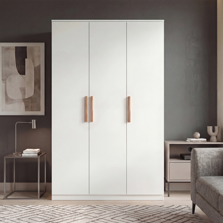 [White] Blythe bedroom furniture set 3 door wardrobe staged against dark grey wall with wood handles