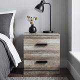 [Ash Grey] Bedside table in use beside bed showing natural wood grain texture with black bar handles and lamp