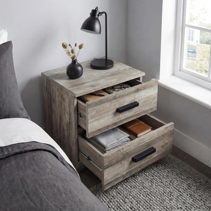 [Ash Grey] Blythe bedside table with both drawers pulled fully open showing folded textiles and a stacked book inside