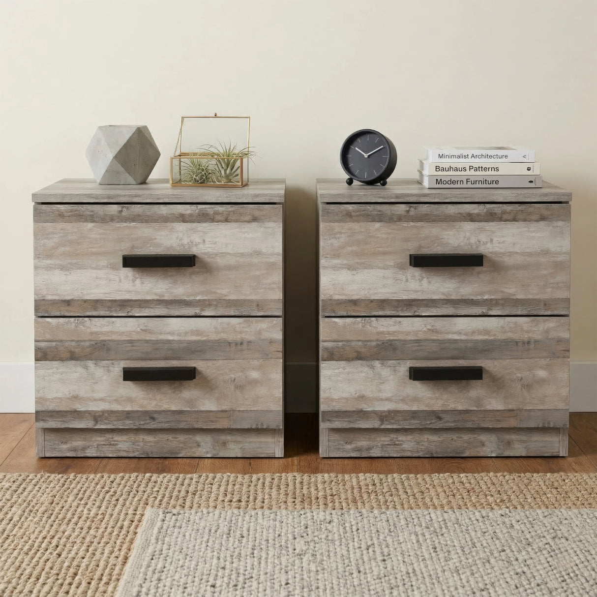 [Ash Grey] Pair of 2 drawer bedside tables with black bar handles on jute rug with books clock and terrarium on top