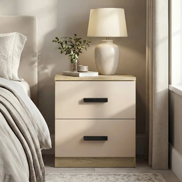 [Oak Cashmere] Cashmere fronted bedside table next to bed, oak top staging white drum lamp, plant and small book
