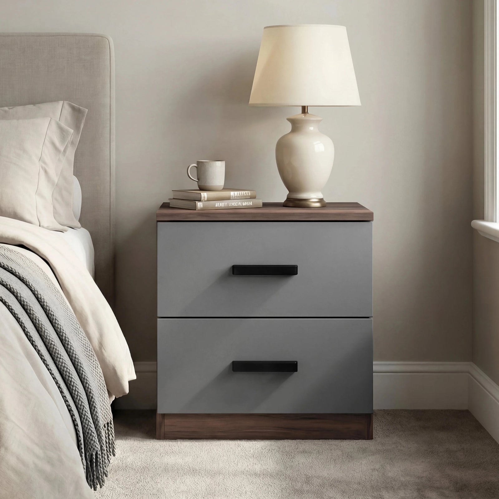 [Walnut Grey] Lifestyle shot of bedside table beside beige fabric headboard with cream drum shade lamp and small white cup