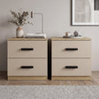[Oak Cashmere] Pair of two drawer bedside tables side by side on woven rug with copper lamp and eucalyptus left, books right