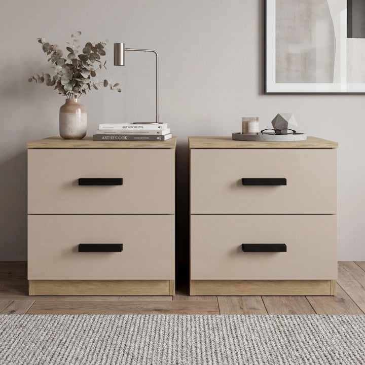 [Oak Cashmere] Pair of two drawer bedside tables side by side on woven rug with copper lamp and eucalyptus left, books right