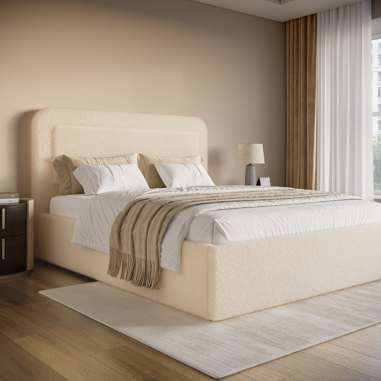 Beige upholstered bed in a modern bedroom with neutral decor