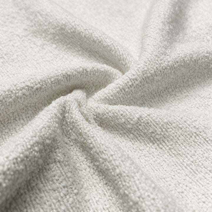 [Cream | Set of 4] Close-up of soft boucle upholstery showing thick textured boucle fabric.