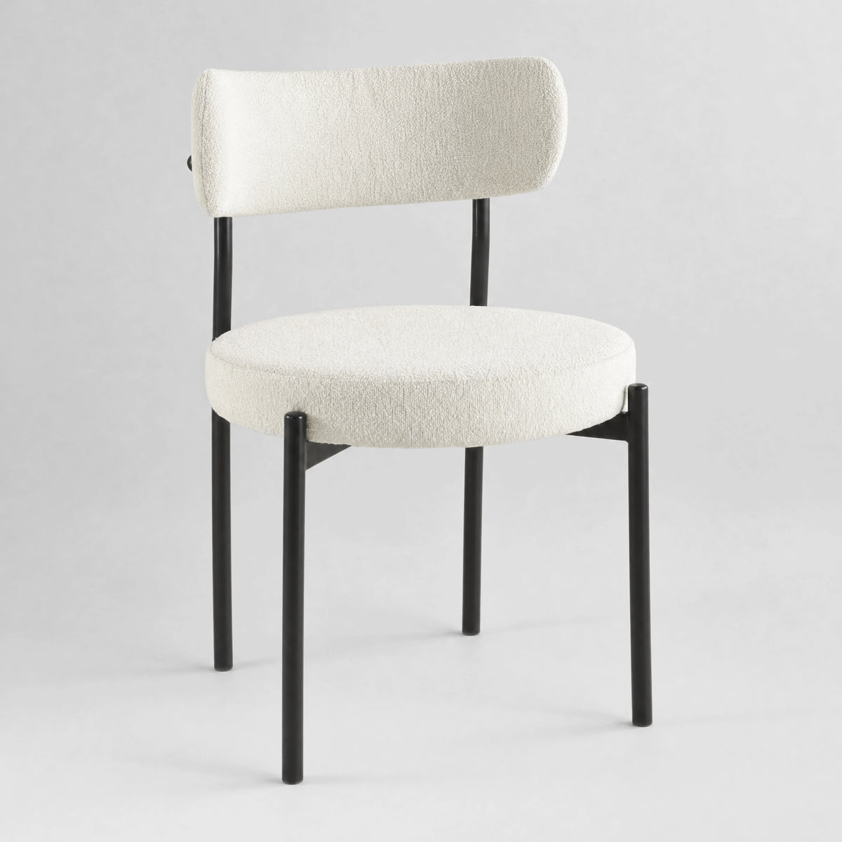 [Cream | Set of 4] Front studio view of boucle dining chair with rounded seat, curved back and black metal legs.