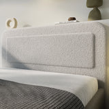 [Double | Grey] Boucle fabric texture close-up on curved headboard with white pillows and neutral bedding below