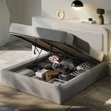 Boucle upholstered ottoman storage bed with curved headboard in grey, featuring gas-lift mechanism and under-bed storage filled with linens and boxes.