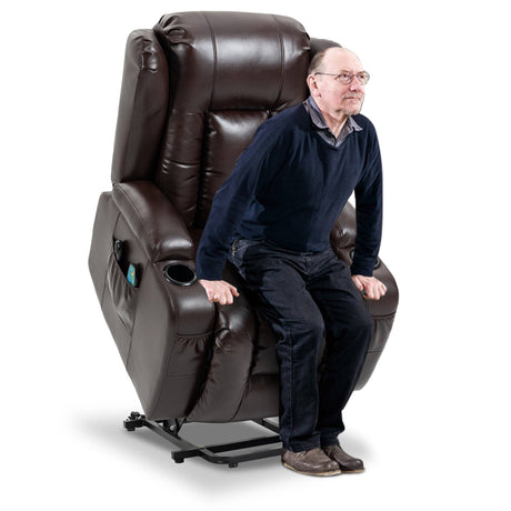 Elderly man using brown riser recliner chair in lift mode. Provides mobility assistance and ergonomic seating for seniors.