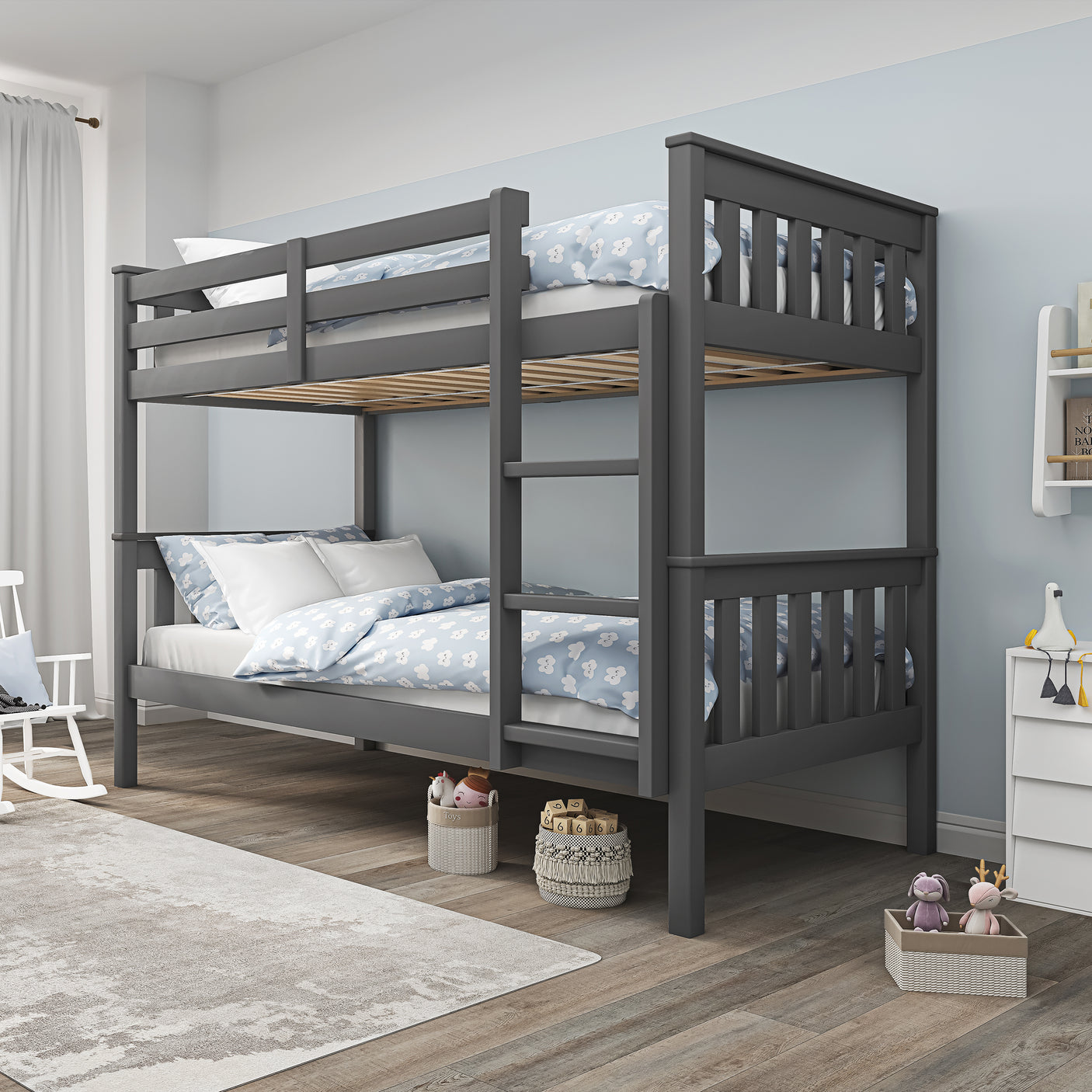 Dark grey kids' bunk bed with blue and white bedding in a bright room, featuring a space-saving and safe design.