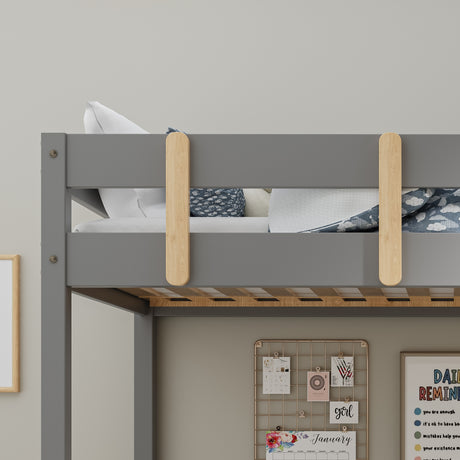 Bunk desk bed with patterned bedding and ladder, perfect for kids' rooms and space-saving.