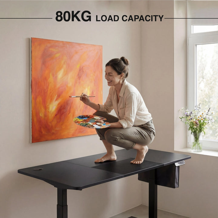 [160cm x 70cm] woman in beige crouching on 160cm black standing desk top painting orange canvas, 80KG load caption