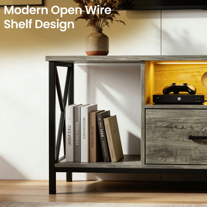 [Grey] Calvera grey TV unit close-up of open side shelf with four upright books and games console on right