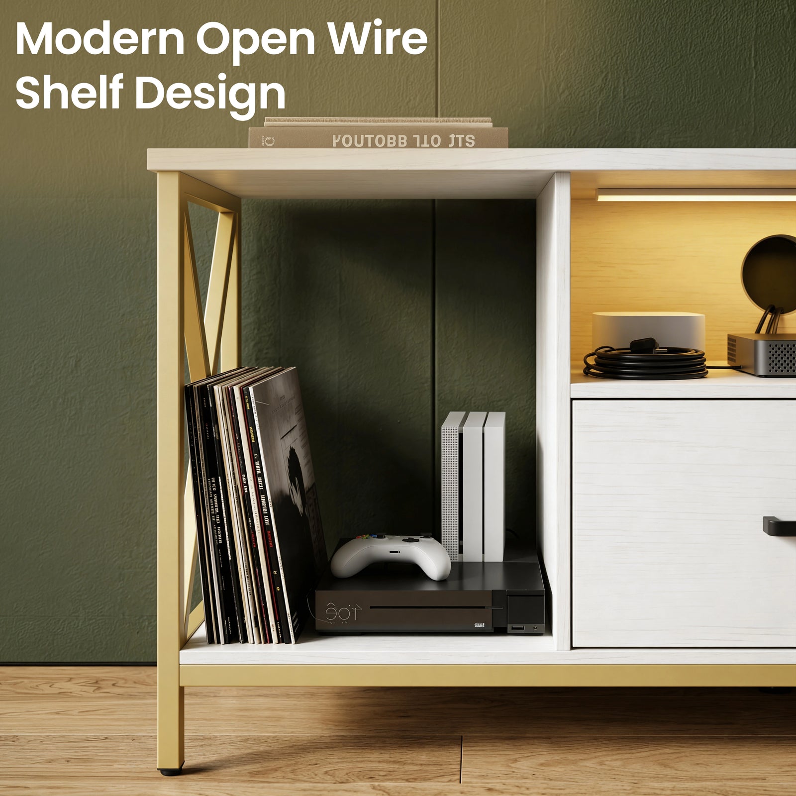 [White] Close-up of Calvera white TV unit left side wire shelf with vinyl records and a black games console inside
