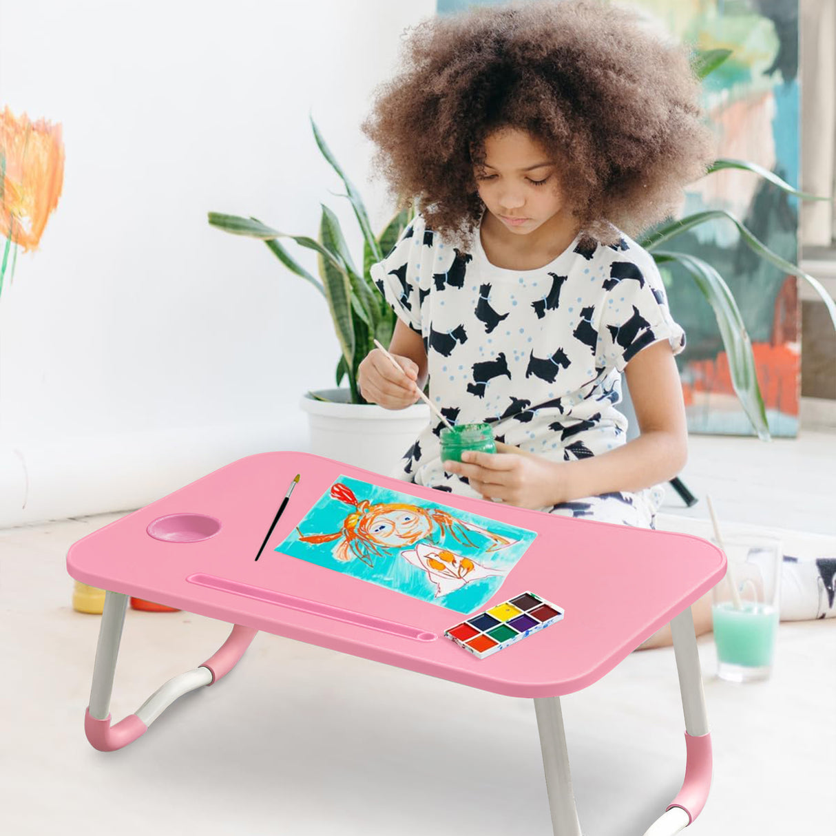 Pink car laptop table with a sturdy, foldable design for convenient use.