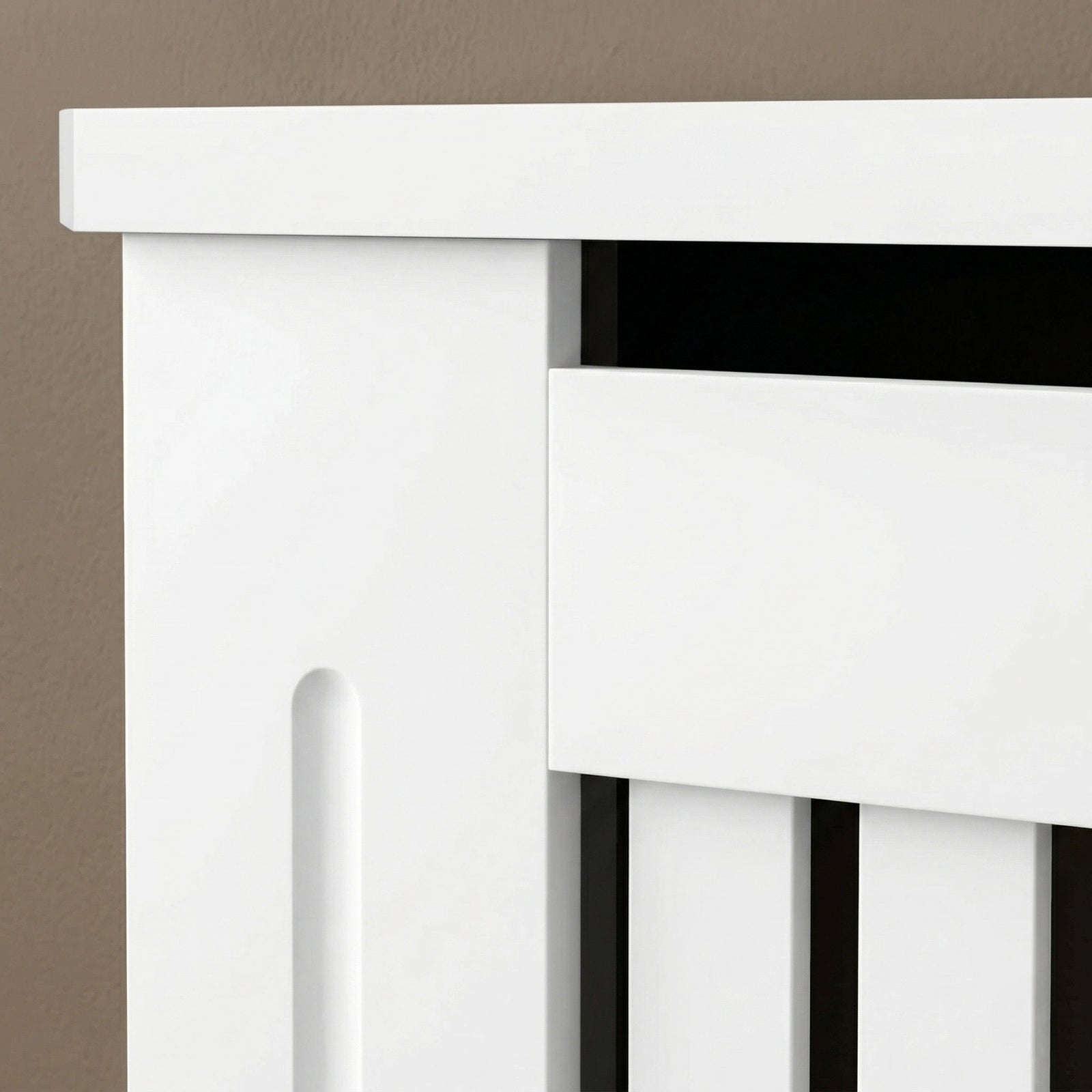 [Medium] Chelsea White Radiator Cover upper corner detail showing top panel overhang, heat gap slot, shaker-style side panel, and vertical slat front