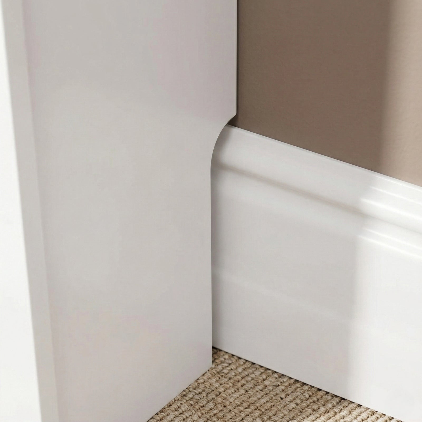 [Medium] Chelsea White Radiator Cover base leg close-up showing recessed skirting board cutout allowing flush fit against a profiled wall skirting