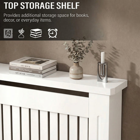 [Medium] Chelsea White Radiator Cover top shelf close-up styled with stacked art books, ceramic bud vase, and silver candle holder