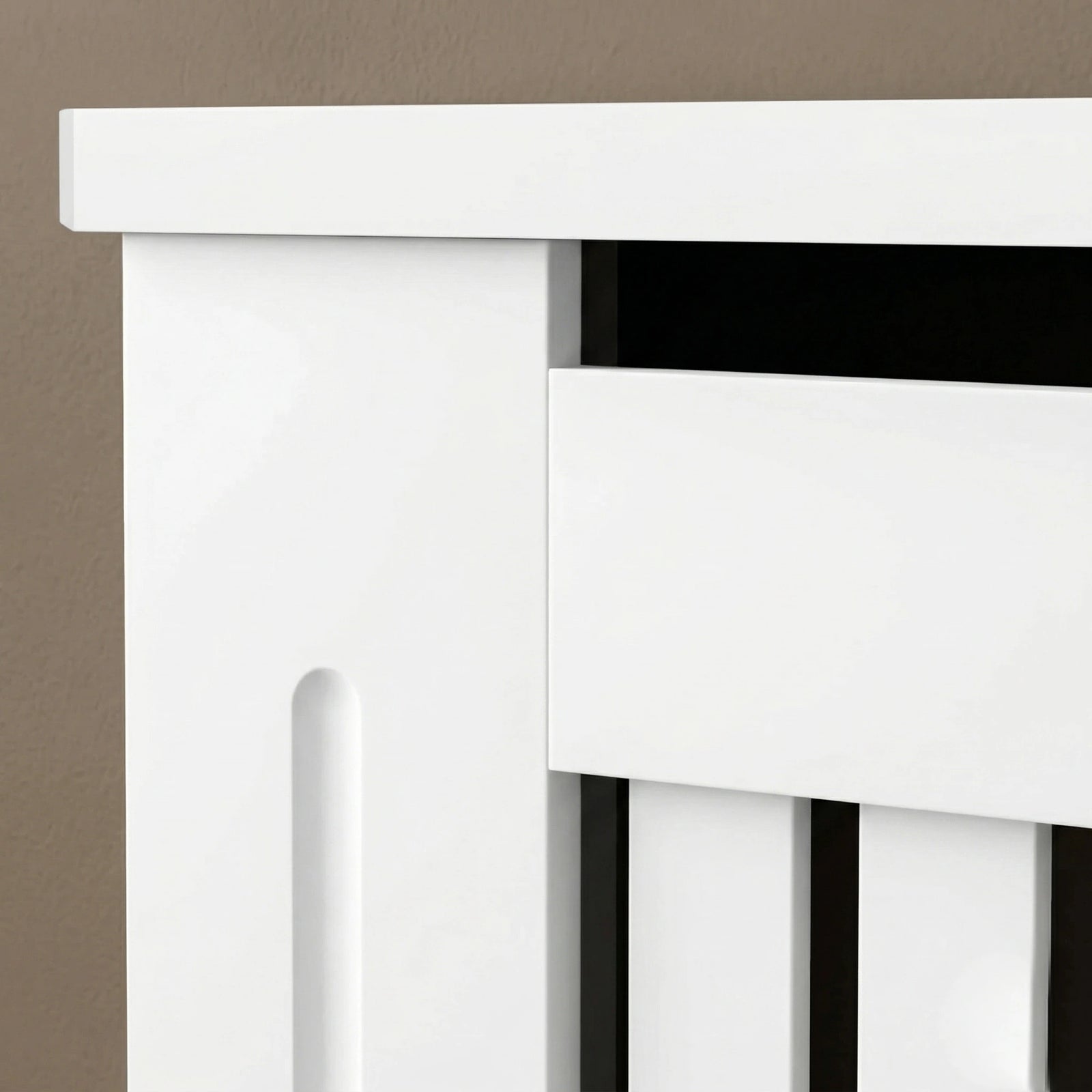 [Small] Chelsea White Radiator Cover upper corner detail showing top panel overhang, heat gap slot, shaker-style side panel, and vertical slat front