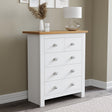 White chest of 5 drawers with flower pot on top stylish and functional bedroom storage