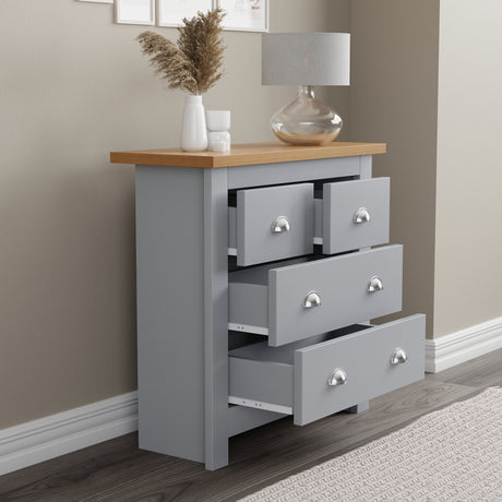 Chest of drawers decor with open drawers showcasing books, coffee mugs, and neatly folded towels.