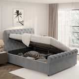 Chesterfield Ottoman Storage Bed in grey with side lift mechanism, showcasing under-bed storage filled with bedding and accessories. Elegant tufted headboard design.