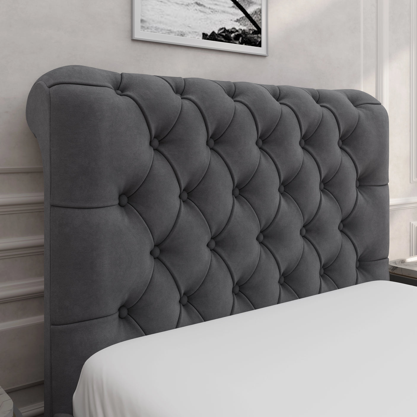Close-up of dark grey Chesterfield headboard with deep button tufting, part of the side lift ottoman bed frame collection.